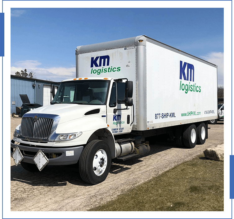 A white truck is parked on the side of the road.